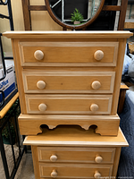 Front view of stacked pair of solid pine nightstands showing drawer configuration and finish