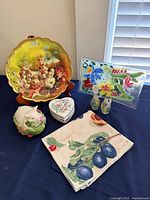 All items arranged: grape tray, fused glass plate, pig bowl, heart box, shakers, towel