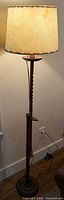 Full view of lamp showing shade, rack pole, tray and base