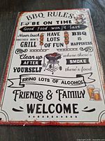 Front of tin sign showing BBQ Rules design