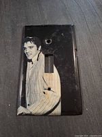 Front view of metal Elvis Presley switch plate cover