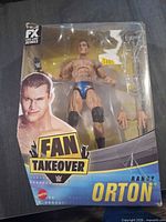 Front view of sealed Randy Orton Elite figure with accessories visible