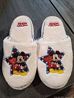 Top view of slippers showing Mickey Mouse embroidery and rhinestone accents