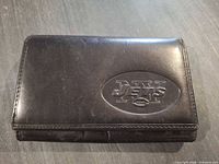 Front view showing embossed New York Jets logo and overall wear