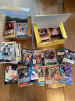 Overview of two boxes and loose cards spread on floor