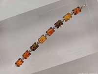 Full view of bracelet front showing all seven amber links