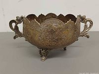 Front view showing engraving, handles, feet