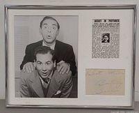 Full view of framed display showing photo, clipping and autograph