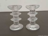 Front view of both textured glass candle holders
