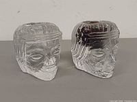 Front view of both glass head votive holders