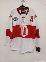 Front view of jersey on hanger