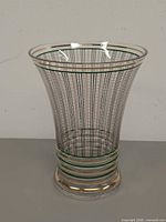 Full view of vase front showing pinstripe pattern and gilt bands