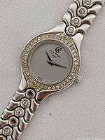 Front view showing dial, crystal bezel, bracelet links