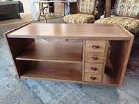 Front view showing drawers, center shelf, side compartment, overall structure