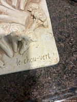 Close-up of French inscription and plaster texture