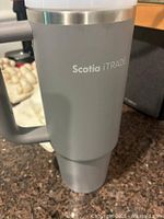 Full view of grey Stanley cup showing Scotia iTRADE logo