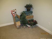 Group shot showing bins, wreath, tree, wrapping paper, potted greenery