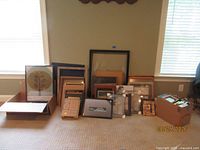 Group of assorted frames arranged on floor