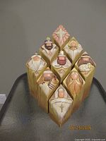 Front view of all nine stacked blocks forming nativity scene