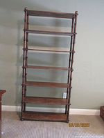 full front view of brown 7-shelf faux bamboo bookcase