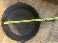 Top view showing interior cooking surface and diameter measurement