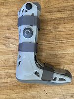 Side view of the Aircast walking boot showing overall design and straps