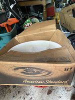Sink in original American Standard box, top view showing white basin