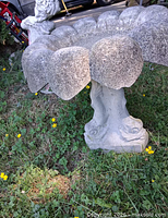 Side view highlighting scalloped bowl and pedestal base