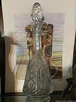 Full view of cut crystal decanter with stopper in place
