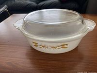 Casserole dish with lid assembled, wheat motif visible