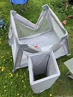 Graco Pack 'n Play partially assembled with mattress pad removed