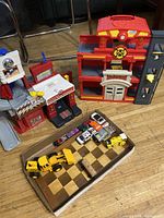 Overview of playsets, wooden box and vehicles