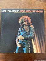 Front cover of Neil Diamond Hot August Night album