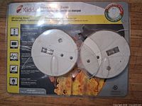 Front of retail package showing two Kidde smoke alarms and printed specifications