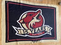 Full view of Arizona Coyotes fleece blanket laid flat showing logo and text