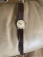 Full view of watch with leather strap
