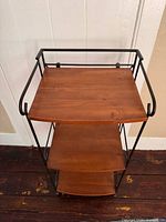 Front view of 3-tier iron frame shelf with wood shelves