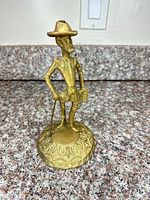 Front view of brass Don Quixote figurine on base