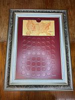 Full framed state quarter display showing burgundy mat and silver ornate frame