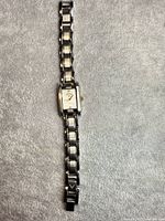 Full view of Callaway two-tone wristwatch laid flat