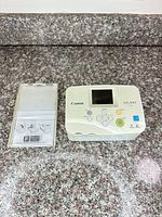 Printer and paper tray on countertop