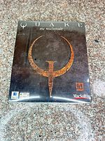 Front of sealed Quake for Macintosh box showing emblem and logos