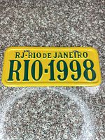 Front of yellow and green RIO-1998 novelty license plate