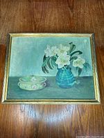 Full view of framed floral oil painting