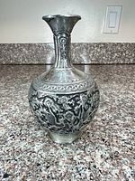 Full front view of silver-plated vase showing overall form and decoration