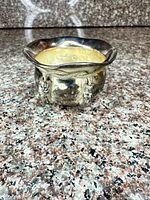 Front view of silver-plated bowl with glass liner inserted