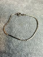 Entire bracelet laid flat showing full chain and clasp