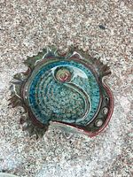Top view of ceramic yarn bowl showing glaze colors and sculpted rim