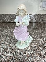 Front view of porcelain girl figurine on countertop