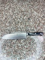 Full view of 7" Zwilling Santoku knife on countertop